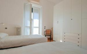 A bed or beds in a room at Conca Del Naviglio by Halldis