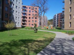 a park in a city with tall buildings at Žvėryno appartment-Self check-in-Free garage in Vilnius