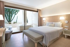 Postel nebo postele na pokoji v ubytování Hotel Omnium