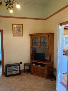 a corner of a room with a tv and a cabinet at Deepwater Bank BnB in Deepwater