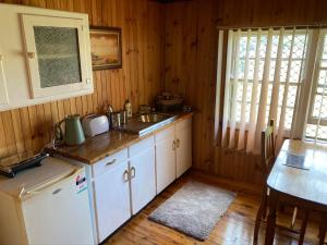 a kitchen with a sink and a counter top at Deepwater Bank BnB in Deepwater