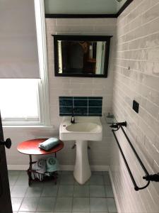 a white bathroom with a sink and a mirror at Deepwater Bank BnB in Deepwater +29 photos