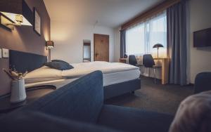 Hotel Ochsen by Mountain Hotels客房内的一张或多张床位