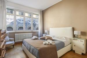 a bedroom with a bed with two towels on it at Luxury Pontevecchio 5 Stars Apartment in Florence