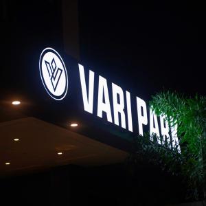 a sign for a varma pharmacy at night at Vari Park - Comfort Stay in Dindigul