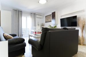 Un televizor și/sau centru de divertisment la Regina Home -Parking Casco Historico