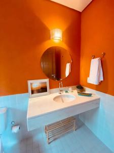 Een badkamer bij Pura Vida Guest House