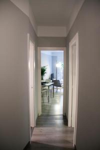 an empty hallway with a dining room and a dining table at Idyllic Apartment with Terrace in Barcelona