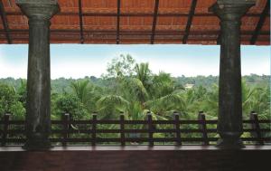 Balkón nebo terasa v ubytování Amrutham Ayurvedic Village Resort + 2 fotografie