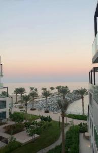 a view of the ocean from a building at Apartment the address resort- Two-Bedroom and maid room in Al Aqah