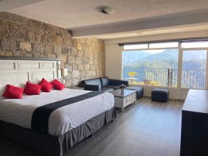 Ένα ή περισσότερα κρεβάτια σε δωμάτιο στο Vista Zacatlan Hotel