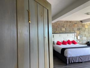 Ένα ή περισσότερα κρεβάτια σε δωμάτιο στο Vista Zacatlan Hotel
