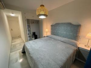 Ένα ή περισσότερα κρεβάτια σε δωμάτιο στο Mi Capricho Luxury Apartment Bajo, P03