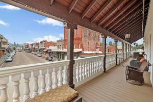 a balcony of a house with a view of a street at National Hotel Jackson in Jackson