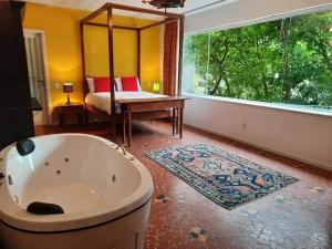 A bed or beds in a room at Rio Boutique Suites