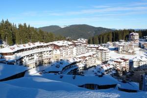 arial view of a town in the snow at Viva 5 apartment Grand Monastery on the ski slopes in Pamporovo