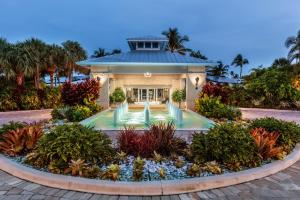 a house with a garden in front of it at Islander Resort in Islamorada