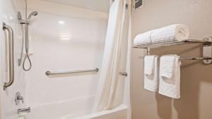 a bathroom with a shower and white towels at Best Western Annapolis in Annapolis +13 photos