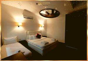 Assaraya Palace Hotel客房内的一张或多张床位