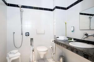 Ein Badezimmer in der Unterkunft NH München Messe