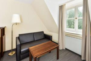 Posezení v ubytování Hotel Klösterle Nördlingen - in Kürze elaya hotel kloesterle noerdlingen