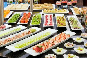 a buffet of different types of food on a table at NH Budapest City in Budapest