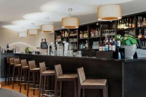 De lounge of bar bij NH Zandvoort Hotel