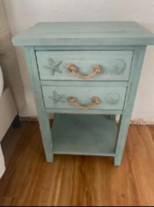 a blue dresser with a chain on top of it at Sunset Sanctuary in Crescent City