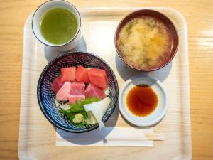 a tray with a bowl of food and a bowl of soup at Tokyu Stay Tsukiji - Tokyo Ginza Area in Tokyo
