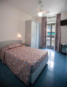 Ένα ή περισσότερα κρεβάτια σε δωμάτιο στο Hotel Park Spiaggia