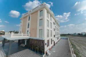 a building with a balcony on the side of it at RAMRATHNA RESIDENCY in Madurai