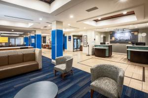 a lobby of a hospital with chairs and a couch at Holiday Inn Express & Suites Rockport - Bay View by IHG in Rockport +41 photos