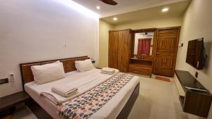 TV a/nebo společenská místnost v ubytování RK RESORTS + 27 fotografií