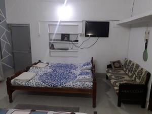 Letto o letti in una camera di Sudha Kutir Puri