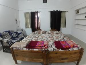 Letto o letti in una camera di Sudha Kutir Puri