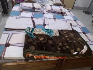 Letto o letti in una camera di Sudha Kutir Puri