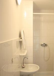 a bathroom with a shower and a sink and a toilet at Dom pod Czarnym Bocianem in Tykocin