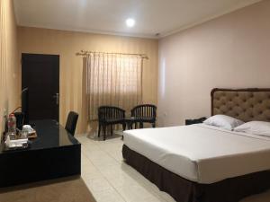 Postel nebo postele na pokoji v ubytování Hotel Sinar 3