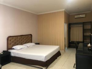 Postel nebo postele na pokoji v ubytování Hotel Sinar 3