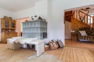 a living room with a table and a fireplace at Forest Chalet, secluded location, 1,000 sqm garden, mountainview, panorama sauna, whirlpool, BBQ&bikes&sunbeds for free, up to 10 p in Golling an der Salzach