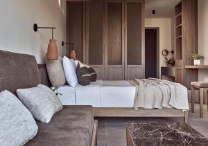 a living room with a bed and a couch at Contessina Hotel in Tsilivi