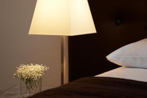 Cama ou camas em um quarto em Hotel Suisse