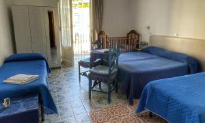 Postel nebo postele na pokoji v ubytování Hotel Europa