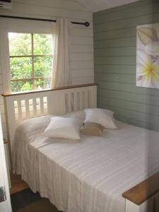 Postel nebo postele na pokoji v ubytování Le Jardin de Beau Vallon