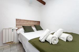 Postel nebo postele na pokoji v ubytování Hauzify I Domus Tarragona