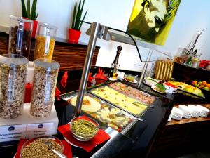 a buffet with a lot of food on a table at Best Western Plus Amedia Art Salzburg in Salzburg