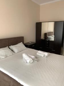 A bed or beds in a room at CENTER APARTMENT PLOVDIV