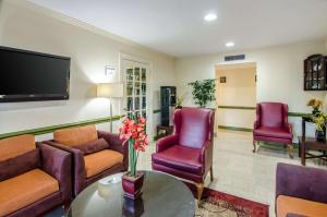 a living room filled with furniture and a tv at Quality Inn Tanglewood in Roanoke