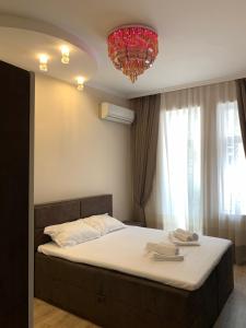 A bed or beds in a room at CENTER APARTMENT PLOVDIV