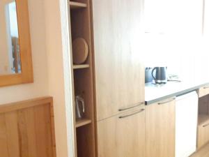a kitchen with a cupboard and a counter top at Appartement La Tania, 4 pièces, 9 personnes - FR-1-513-8 in La Tania